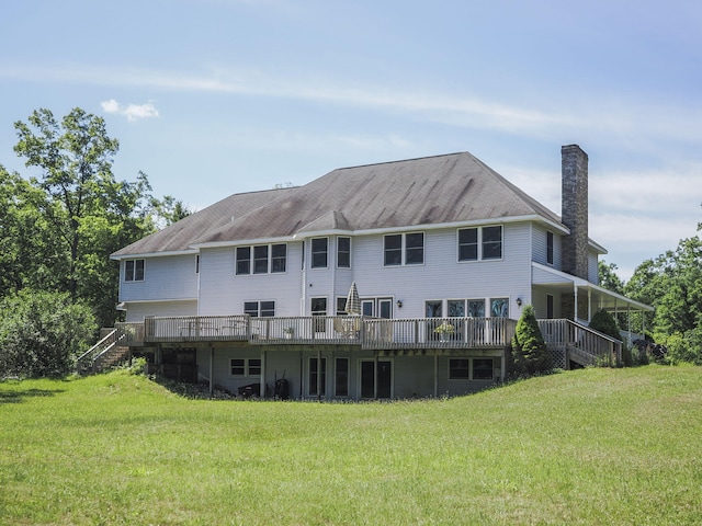 626 Skocelas Rd N, Manistee, MI 49660 - back of property with stairway, a chimney, and a yard