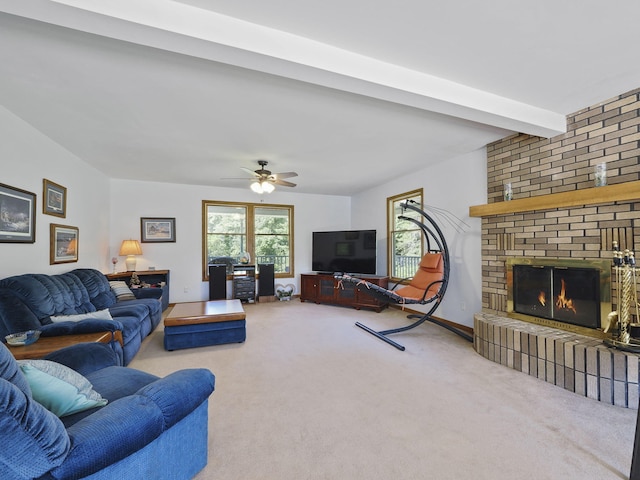 626 Skocelas Rd N, Manistee, MI 49660 - living area with a fireplace, carpet, and ceiling fan