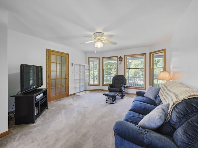 626 Skocelas Rd N, Manistee, MI 49660 - living room featuring light carpet and ceiling fan