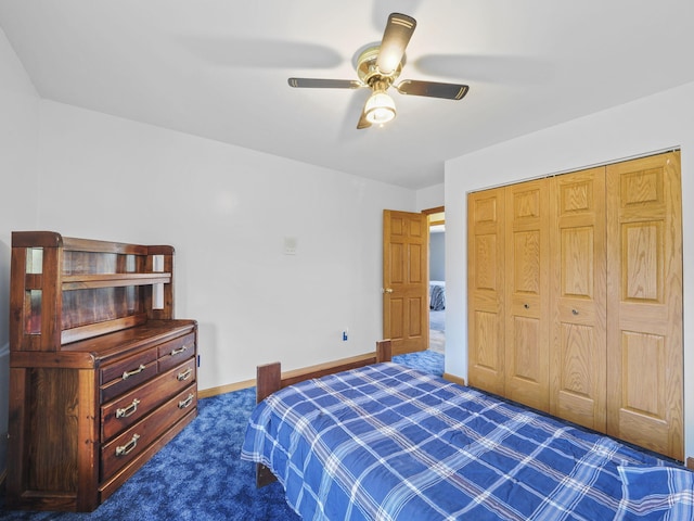 626 Skocelas Rd N, Manistee, MI 49660 - bedroom with dark colored carpet, a ceiling fan, and a closet