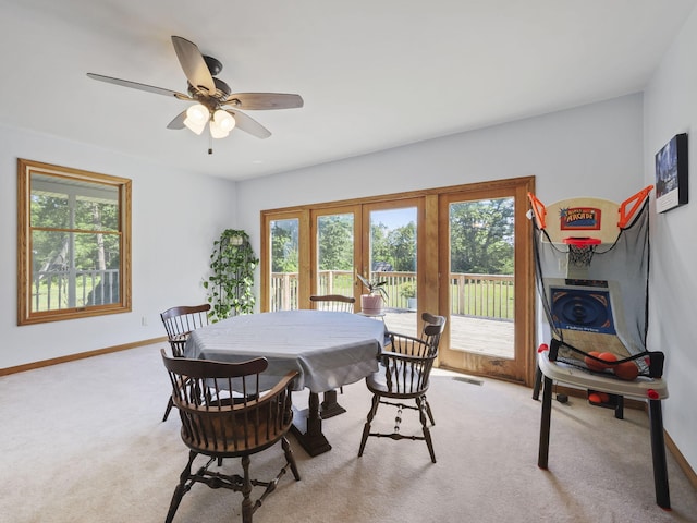 626 Skocelas Rd N, Manistee, MI 49660 - dining space featuring plenty of natural light and light carpet