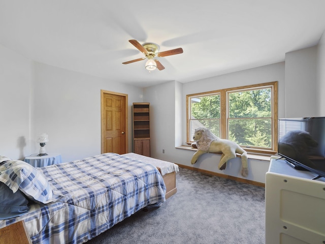 626 Skocelas Rd N, Manistee, MI 49660 - carpeted bedroom with baseboards and ceiling fan