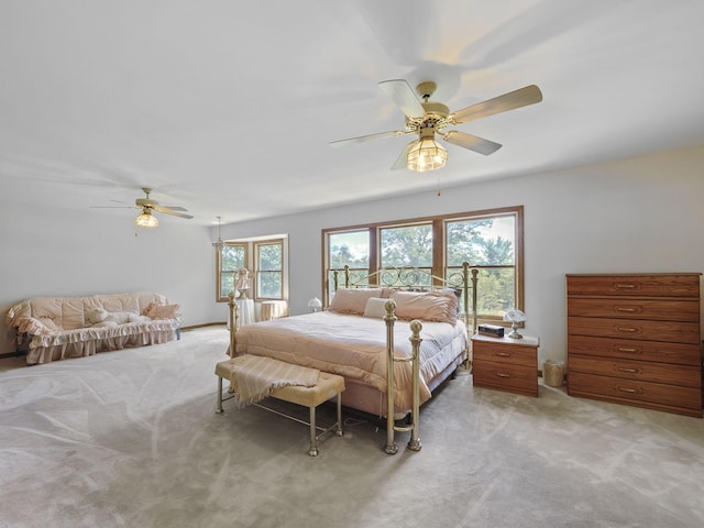 626 Skocelas Rd N, Manistee, MI 49660 - bedroom featuring light carpet and a ceiling fan