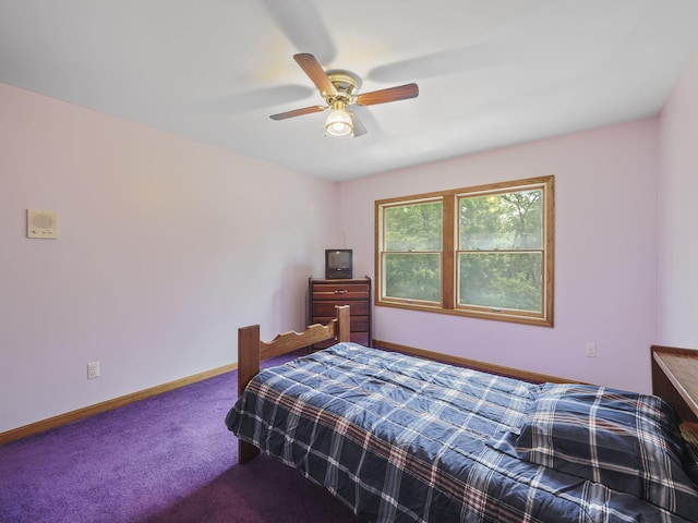 626 Skocelas Rd N, Manistee, MI 49660 - carpeted bedroom featuring ceiling fan and baseboards