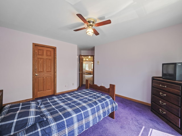 626 Skocelas Rd N, Manistee, MI 49660 - carpeted bedroom with baseboards and ceiling fan
