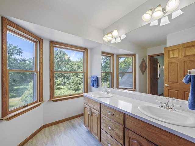 626 Skocelas Rd N, Manistee, MI 49660 - bathroom with double vanity and healthy amount of natural light