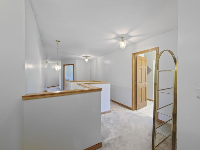 626 Skocelas Rd N, Manistee, MI 49660 - hallway with light carpet and an upstairs landing