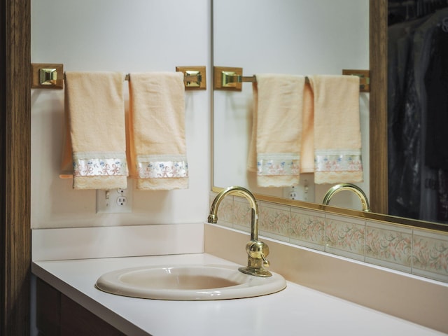 626 Skocelas Rd N, Manistee, MI 49660 - bathroom view of decorative backsplash and vanity