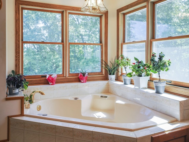 626 Skocelas Rd N, Manistee, MI 49660 - bathroom featuring a garden tub and a chandelier