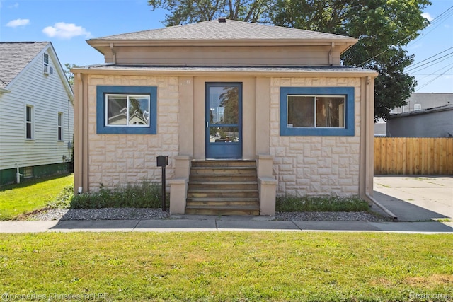 128 N Mary St, Marine City, MI 48039 - view of front of property featuring entry steps, stone siding, and roof with shingles