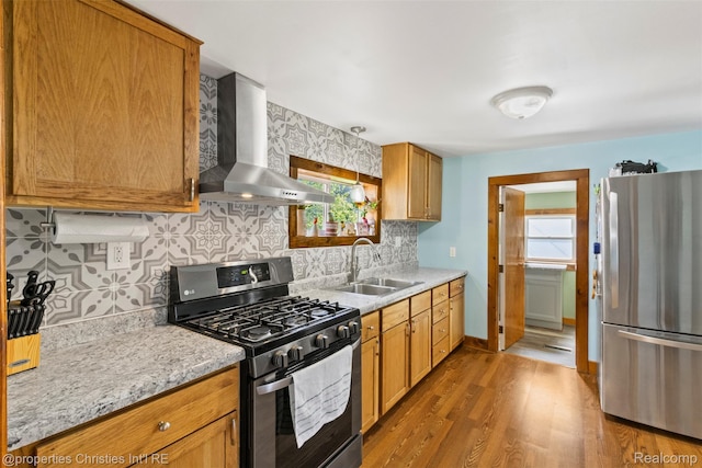 128 N Mary St, Marine City, MI 48039 - kitchen with stainless steel appliances, wall chimney exhaust hood, healthy amount of natural light, and wood finished floors