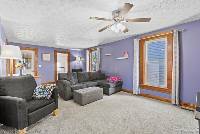 128 N Mary St, Marine City, MI 48039 - living room featuring carpet floors, a ceiling fan, and a textured ceiling