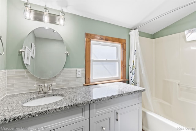 128 N Mary St, Marine City, MI 48039 - full bath featuring shower / bath combination with curtain, decorative backsplash, vanity, and lofted ceiling