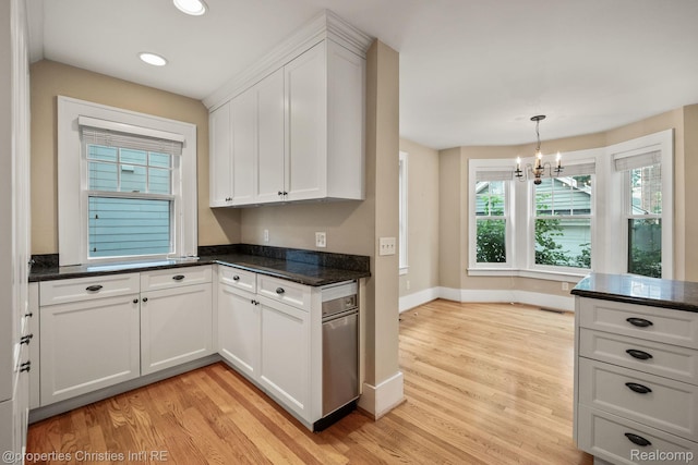 532 Wallace St, Southfield, MI 48009 - kitchen featuring light wood finished floors, white cabinets, recessed lighting, a chandelier, and dark stone counters