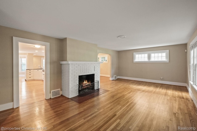 532 Wallace St, Southfield, MI 48009 - unfurnished living room featuring a fireplace and light wood-style flooring