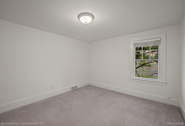 532 Wallace St, Southfield, MI 48009 - spare room featuring light colored carpet and baseboards