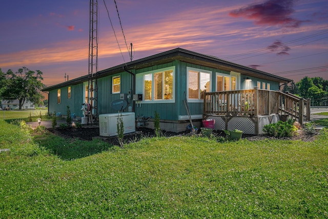 53266 US-131, Three Rivers, MI 49093 - view of home's exterior with a lawn and a wooden deck