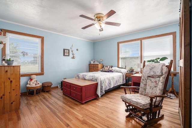 53266 US-131, Three Rivers, MI 49093 - bedroom featuring light wood-style flooring, ornamental molding, and ceiling fan