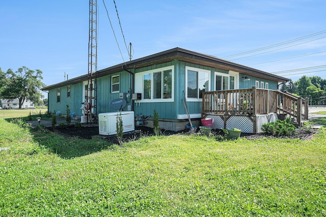 53266 US-131, Three Rivers, MI 49093 - view of side of property featuring a yard and a wooden deck