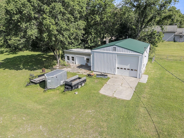 53266 US-131, Three Rivers, MI 49093 - view of yard featuring an outbuilding, a detached garage, and driveway