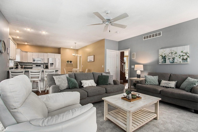 4202 Courtney St, Saint Joseph, MI 49085 - living area with a ceiling fan, a chandelier, and recessed lighting