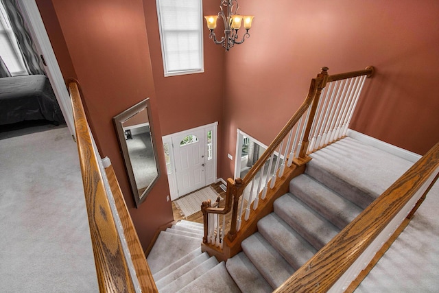 4202 Courtney St, Saint Joseph, MI 49085 - carpeted entrance foyer featuring a chandelier and a towering ceiling