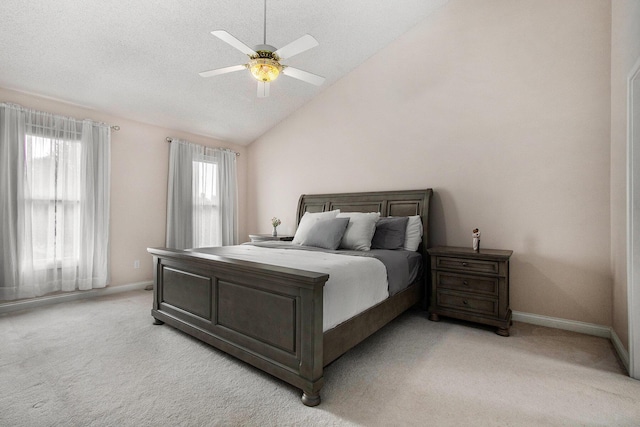 4202 Courtney St, Saint Joseph, MI 49085 - bedroom featuring light colored carpet, multiple windows, vaulted ceiling, and a ceiling fan