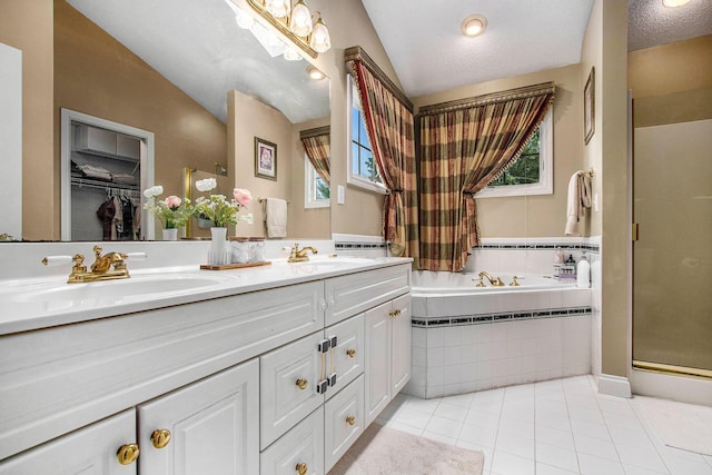 4202 Courtney St, Saint Joseph, MI 49085 - full bathroom featuring a stall shower, double vanity, plenty of natural light, tile patterned floors, and vaulted ceiling