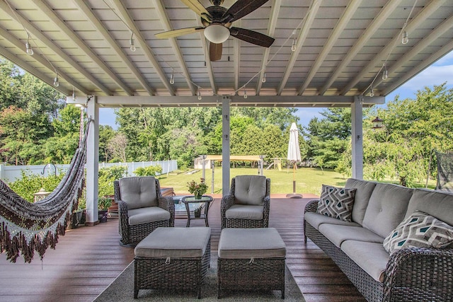 4202 Courtney St, Saint Joseph, MI 49085 - wooden terrace with an outdoor living space, a ceiling fan, and view of scattered trees