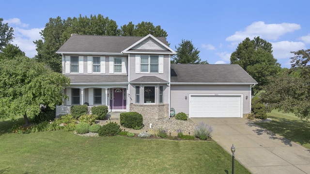4202 Courtney St, Saint Joseph, MI 49085 - view of front facade featuring an attached garage, driveway, a front lawn, and a porch