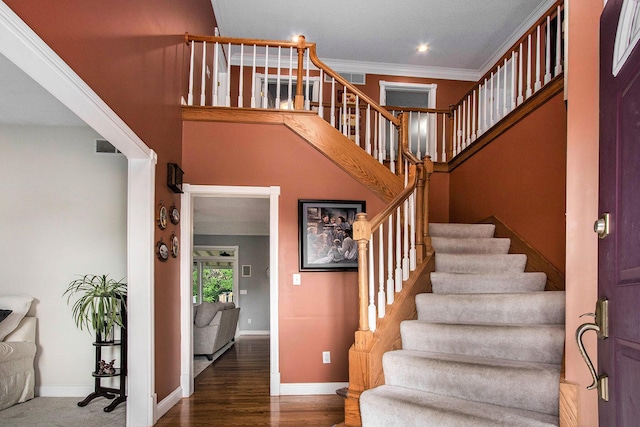 4202 Courtney St, Saint Joseph, MI 49085 - stairs with wood finished floors, ornamental molding, and recessed lighting