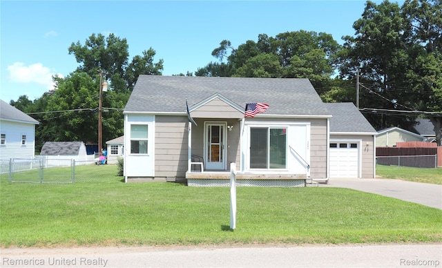 4685 Downing Dr, Pinckney, MI 48169 - view of front of house featuring a garage, concrete driveway, and a shingled roof