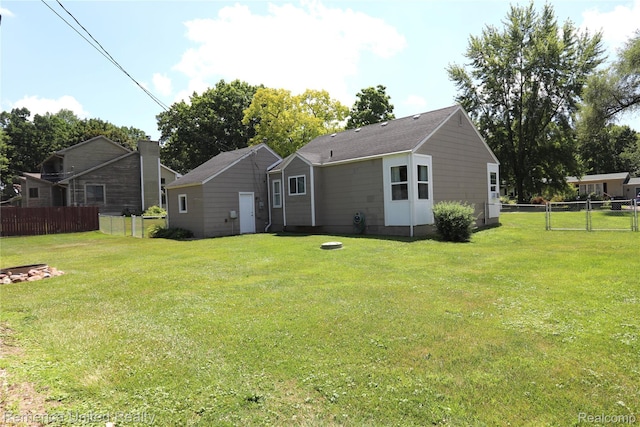 4685 Downing Dr, Pinckney, MI 48169 - rear view of house with a gate