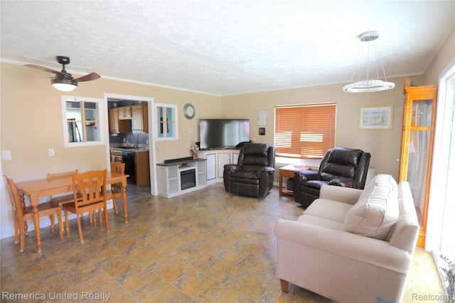 4685 Downing Dr, Pinckney, MI 48169 - living area with a textured ceiling, a ceiling fan, and crown molding