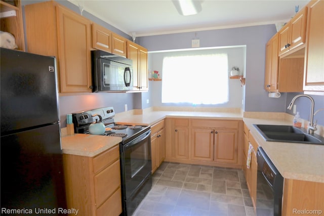 4685 Downing Dr, Pinckney, MI 48169 - kitchen with black appliances, light brown cabinetry, light countertops, and stone finish flooring