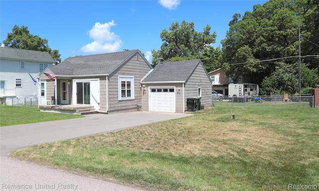 4685 Downing Dr, Pinckney, MI 48169 - view of front of house with concrete driveway, a garage, and roof with shingles