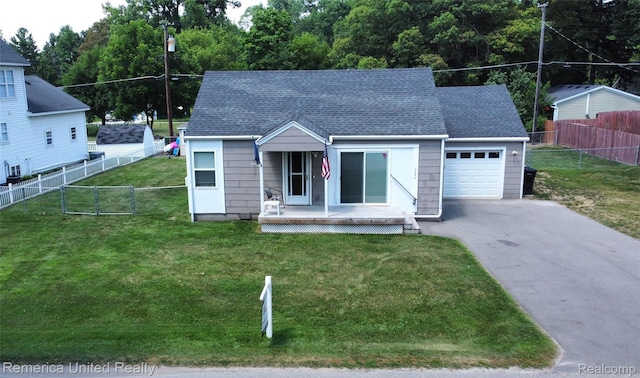 4685 Downing Dr, Pinckney, MI 48169 - view of front of property with driveway, a garage, and roof with shingles