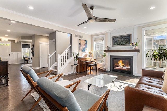 6217 S Trailwoods Dr, Ann Arbor, MI 48103 - living room with wood finished floors, a fireplace with flush hearth, a ceiling fan, ornamental molding, and recessed lighting