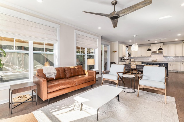 6217 S Trailwoods Dr, Ann Arbor, MI 48103 - living room featuring crown molding, recessed lighting, ceiling fan, and dark wood-style flooring