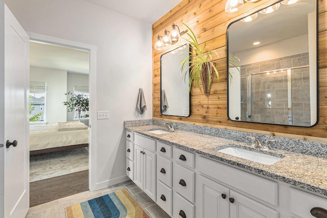 6217 S Trailwoods Dr, Ann Arbor, MI 48103 - ensuite bathroom featuring double vanity and a shower stall