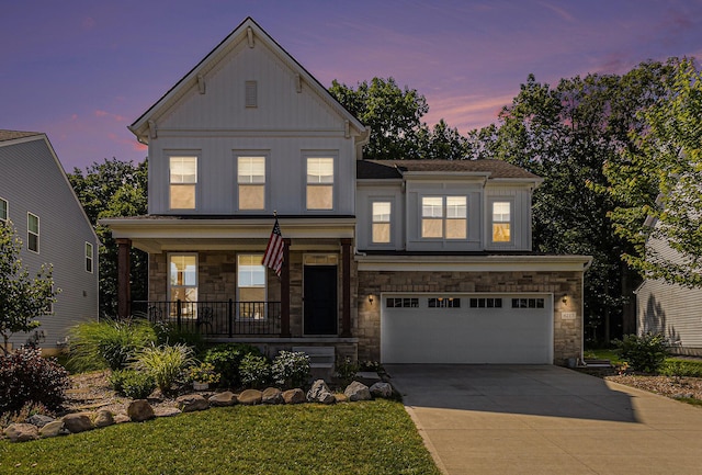 6217 S Trailwoods Dr, Ann Arbor, MI 48103 - view of front facade featuring a porch, stone siding, board and batten siding, and concrete driveway