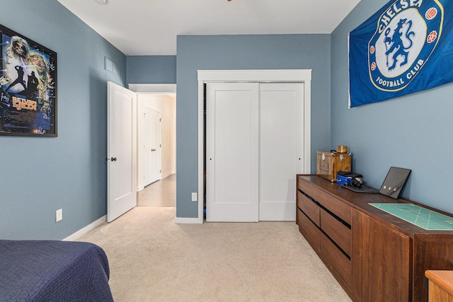 6217 S Trailwoods Dr, Ann Arbor, MI 48103 - carpeted bedroom featuring a closet and baseboards