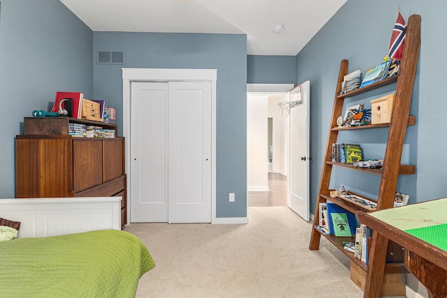 6217 S Trailwoods Dr, Ann Arbor, MI 48103 - carpeted bedroom featuring a closet and baseboards