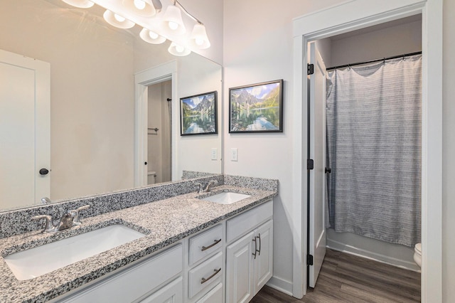 6217 S Trailwoods Dr, Ann Arbor, MI 48103 - full bath featuring double vanity and wood finished floors