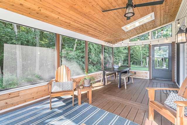 6217 S Trailwoods Dr, Ann Arbor, MI 48103 - sunroom with a skylight, ceiling fan, lofted ceiling, and outdoor dining space