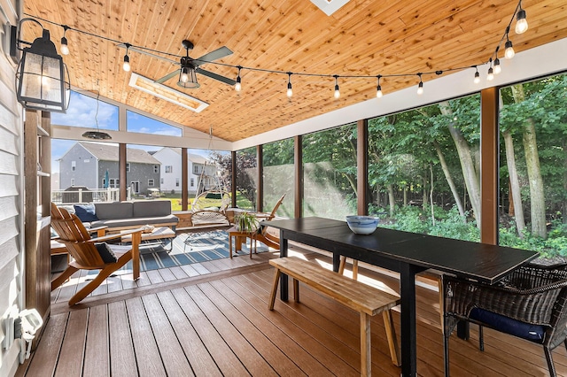 6217 S Trailwoods Dr, Ann Arbor, MI 48103 - sunroom / solarium featuring rail lighting, a skylight, a wooden deck, hardwood / wood-style flooring, and wooden ceiling