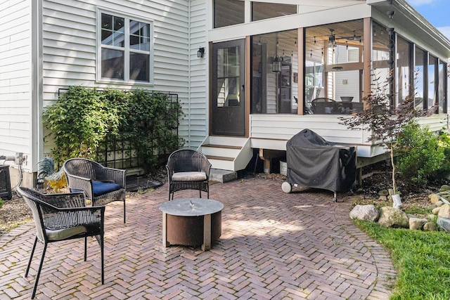 6217 S Trailwoods Dr, Ann Arbor, MI 48103 - view of patio / terrace featuring a sunroom, a grill, and entry steps