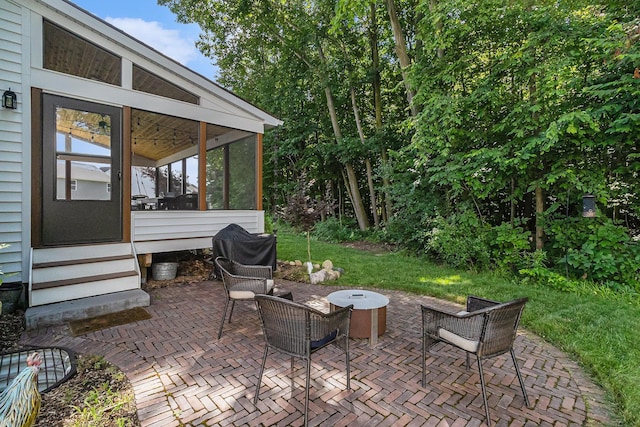 6217 S Trailwoods Dr, Ann Arbor, MI 48103 - view of patio featuring entry steps, a sunroom, and a grill