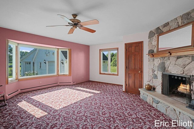 4305 76th St SW, Byron Center, MI 49315 - unfurnished living room with ceiling fan, a stone fireplace, and carpet flooring