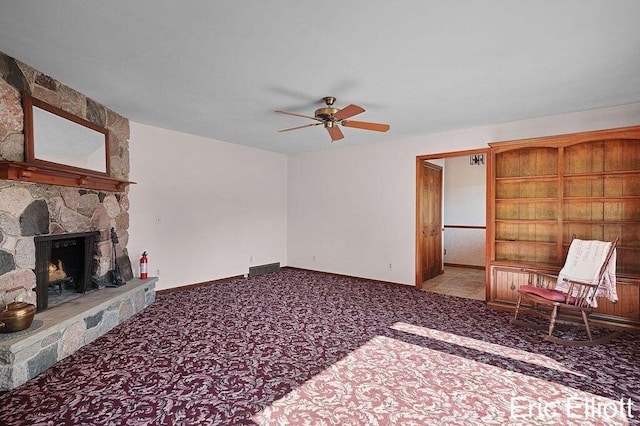 4305 76th St SW, Byron Center, MI 49315 - unfurnished living room featuring carpet, a ceiling fan, and a fireplace